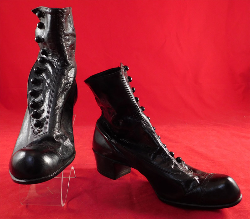 Victorian Unworn Womans Black Kid Leather High Top Button Boots
The boots measure 7 inches tall, 9 1/2 inches long and 3 inches wide, with a 1 1/2 inch high heel. These antique boots are difficult to size for today's foot, but are approximately a US size 6 narrow width.
