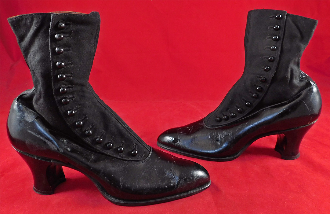 Unworn Edwardian Black Cloth Patent Leather High Top Button Boots & Shoe Box
These womens beautiful black boots have a pointed toe, 14 black shoe buttons along the side for closure and black patent leather covered French spool heels. They come in the original shoe box covered with a wonderful spider web cobweb graphics foil paper from "The Harris Shoe Store" in Dover, New Jersey and are stamped on the outside of the box a European size 37. The boots measure 9 inches tall, 10 1/2 inches long, 3 inches wide, with 2 1/2 inch high heels. 