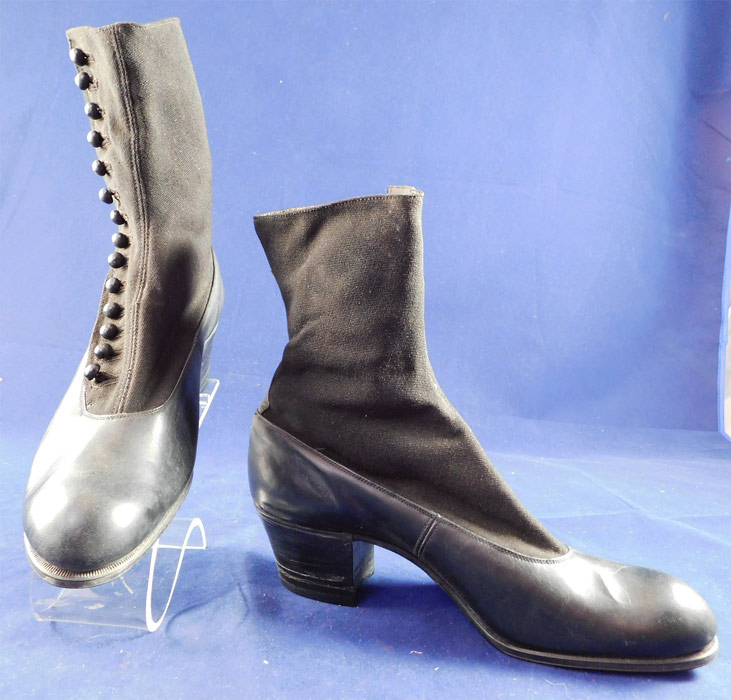 Unworn Edwardian Black Cloth Top Kid Leather Button Boots & Shoe Box
The boots measure 8 1/2 inches tall, 9 inches long, 2 3/4 inches wide, with a 1 1/2 inch high heel and are approximately US size 6 or 7.