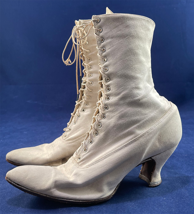 Victorian Antique White Canvas High Top Lace-up Boots French Spool Heels
These beautiful boots have slightly upturned pointed toes, the original shoe string laces which are a bit frayed and canvas covered French spool heels. The boots measure 10 inches tall, 10 1/2 inches long, 3 inches wide, with a 3 inch high heel. 