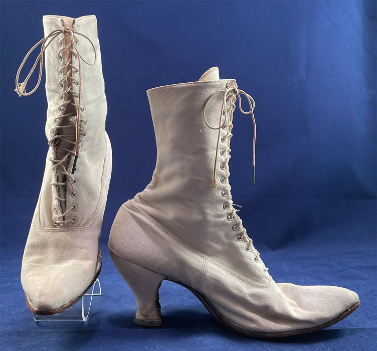 Victorian Antique White Canvas High Top Lace-up Boots French Spool Heels
These antique boots are difficult to size for today's foot and are approximately a US size 7 narrow width.