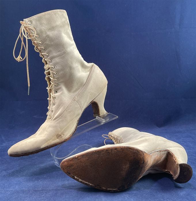 Victorian Antique White Canvas High Top Lace-up Boots French Spool Heels
They are in good wearable condition, have been worn with wear on the bottom leather soles and some small faint stains. These are truly a wonderful piece of quality made wearable shoe art.