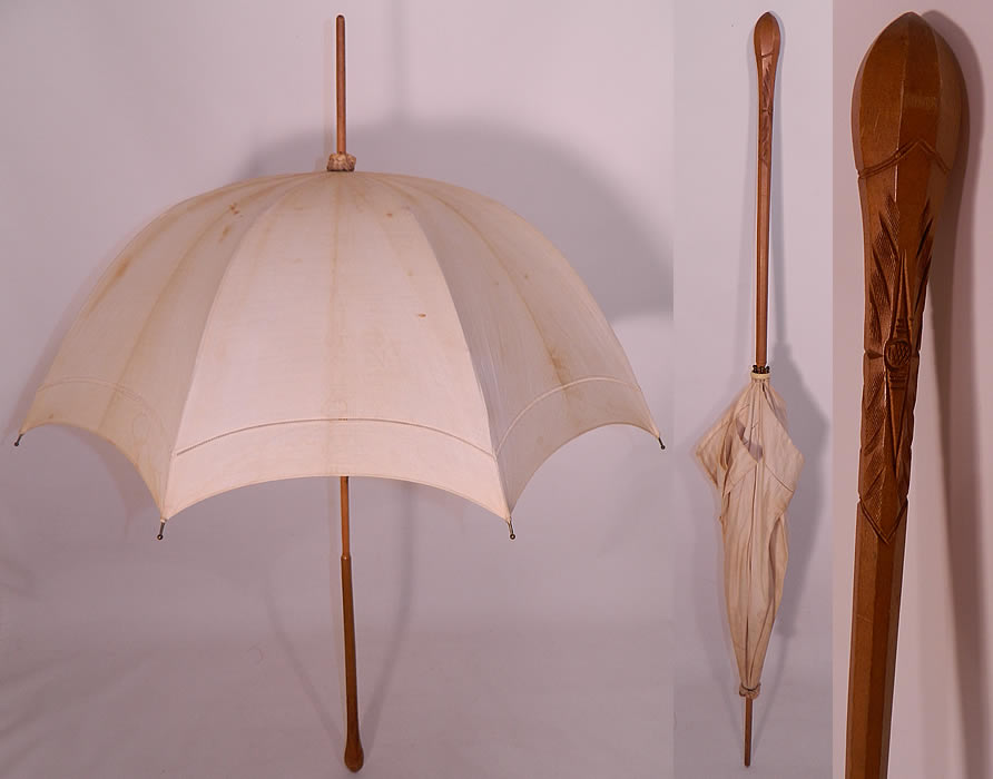 Edwardian Ecru Linen Carved Wood Handle Summer Pagoda Parasol. This Edwardian era antique ecru linen carved wood handle summer pagoda parasol dates from 1910. 