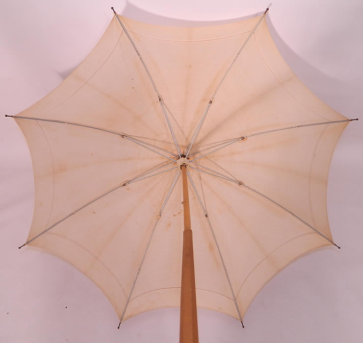 Edwardian Ecru Linen Carved Wood Handle Summer Pagoda Parasol. The parasol measures 41 inches long and 96 inches in circumference when opened. It is in good useable condition, but has some yellowing staining along the folds and water spots. 