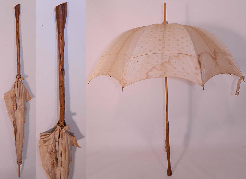 Edwardian Polka Dot Linen Burl Wood Handle Summer Pagoda Parasol. This Edwardian era antique polka dot linen burl wood handle summer pagoda parasol dates from 1910. It is made of an off white ecru cream color linen fabric, with a oval shape circular polka dot pattern design and drawn cut work edging.