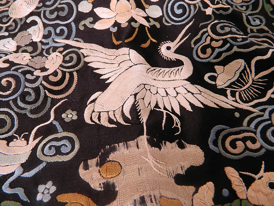 Antique Chinese Silk Embroidered Crane Bird First Rank Badge Tassel Trim. There is some missing thread embroidery work on the rock the bird is standing on and some slight fraying of the black silk backing. The badge measures 11 1/2 by 11 1/2 inches.