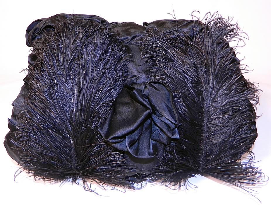 Victorian Black Silk Ostrich Feather Plume Trim  Winter Muff Hand Warmer. This antique Victorian era black silk ostrich feather plume trim winter muff handwarmer dates from 1900. This is truly a beautiful piece of antique Victoriana feather textile art! 