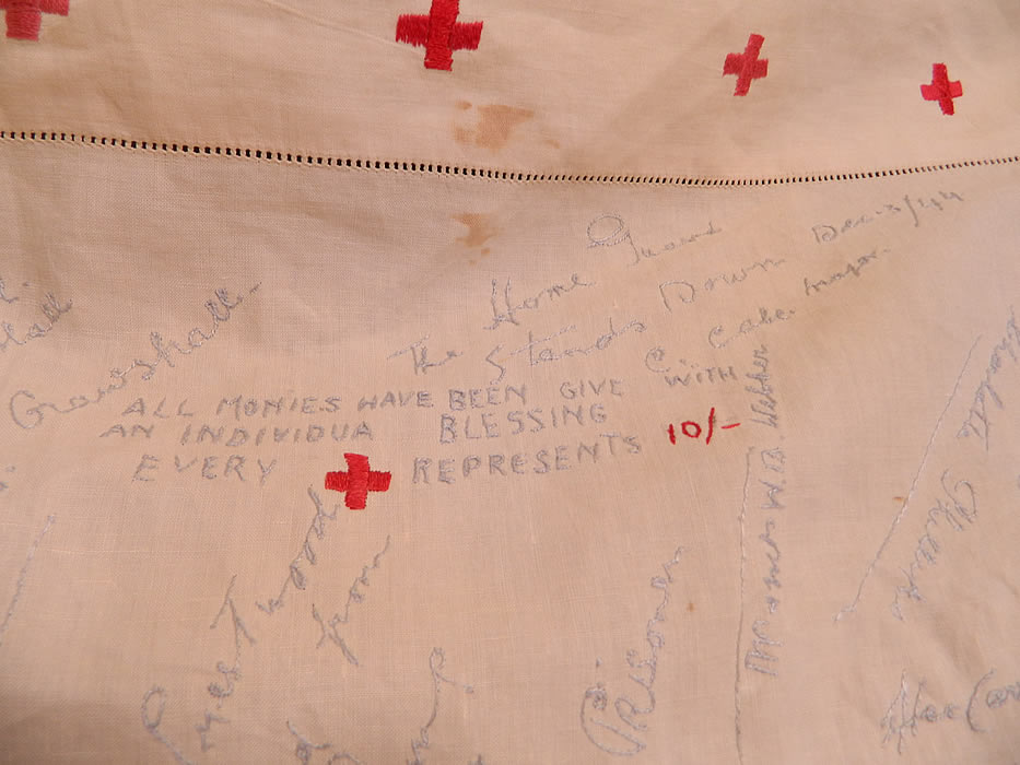 Vintage End of WWII Allies British Red Cross Signature Embroidered Linen Tablecloth. The tablecloth measures 52 by 55 inches. It is in good condition, has not been cleaned and has several faint age spots stains and a small mend patched repair 