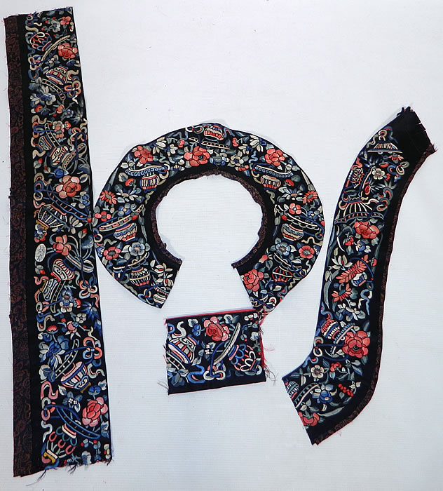 Antique Chinese Silk Embroidered Robe Trim Sleeve Band Cuff Collar. This lot of antique Chinese silk embroidered robe trim sleeve band cuff collar dates from the late 19th century during the Qing Dynasty. It is hand stitched, made of a dark midnight blue silk fabric background, with colorful silk raised padded satin stitch hand embroidery work.