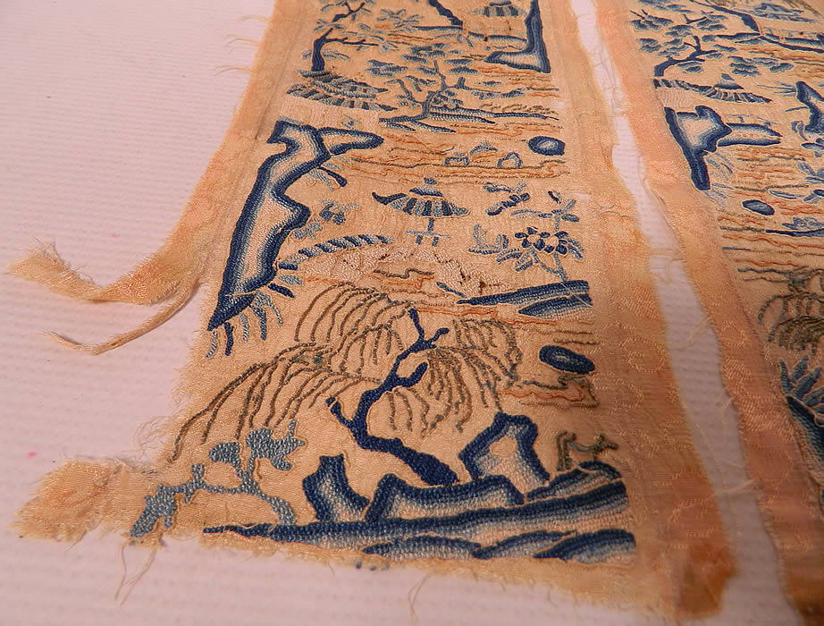 Antique Chinese Silk Embroidered Forbidden Stitch Robe Sleeve Band Cuffs Pair. They are hand stitched, made of a pale peach color silk damask weave fabric. There are intricately done tiny forbidden stitch Peking knot hand embroidery work done in a scenic picturesque landscape design with blue highlight accents.