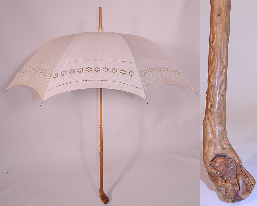 Edwardian White Linen Eyelet Burl Wood Handle Summer Pagoda Parasol. This Edwardian era antique white linen eyelet burl wood handle summer pagoda parasol dates from 1910. It is made of an off white linen fabric, with a circular polka dot embroidered pattern design, eyelet and drawn cut work edging.