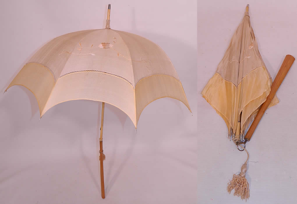 Edwardian Ecru Cream Silk Embroidered Folding Wood Handle  Pagoda Parasol. This Edwardian era antique ecru cream silk embroidered folding wood handle pagoda parasol dates from 1910. It is made of an ecru and cream color silk fabric, with drawn cut work edging and pale pastel peach silk raised padded satin stitch embroidery work flowers. 