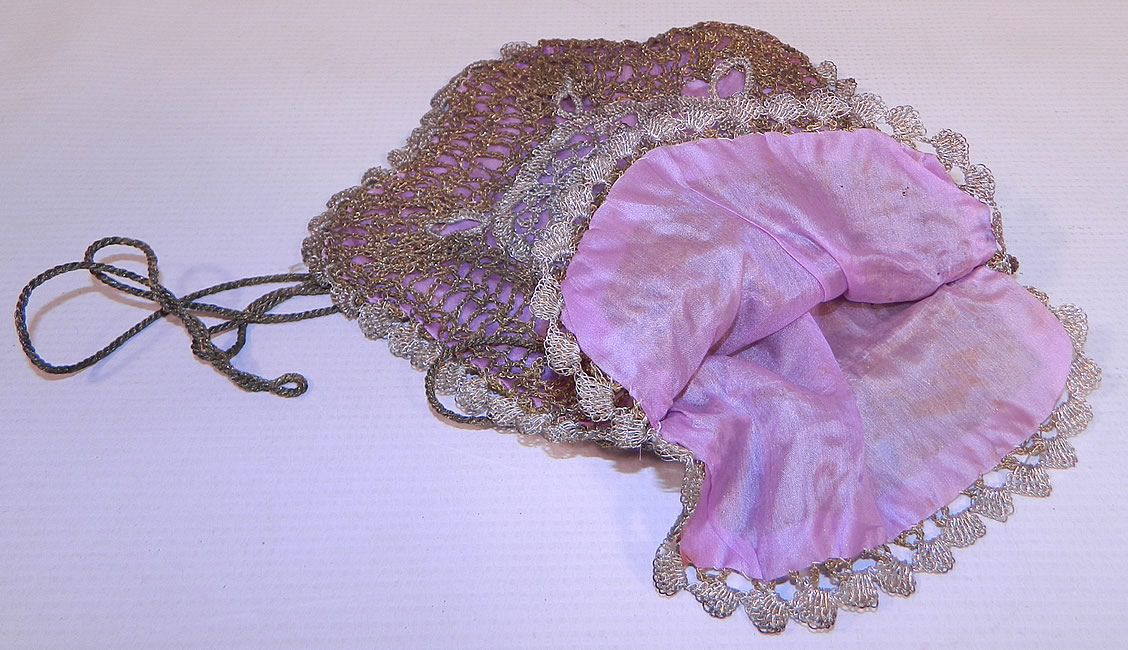 Vintage  Gold & Silver Lam&eacute; Lame Crochet Lace Reticule Flapper Bag Purse. This fabulous flapper bag reticule style small pouch purse has a gold bullion rope cord drawstring closure at the top and is fully lined in a lavender purple silk lining inside. The purse measures 9 inches long and 7 inches wide. It is in good condition. This is truly a wonderful piece of antique textile lace art! 