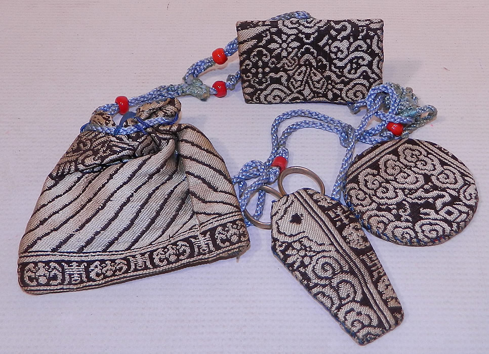 Antique Chinese Woven Silk Sewing Etui Scissors Pouch Needle Case Chatelaine
This antique Chinese woven silk sewing etui scissors pouch needle case chatelaine dates from the 1920s. It is hand stitched and made of earlier antique Chinese weave silk fabrics perhaps cut from a civil rank badge, with black and white woven designs of bats, a bird wing, waves of water, Xi character for joy and swastika character for longevity.