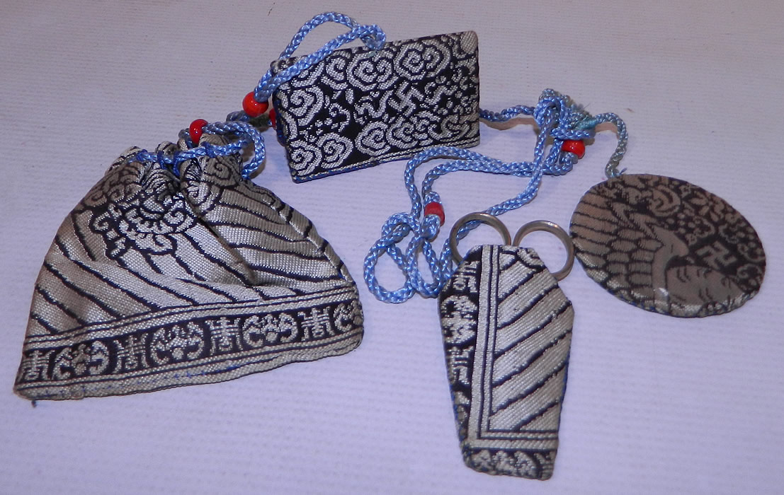 Antique Chinese Woven Silk Sewing Etui Scissors Pouch Needle Case Chatelaine
This stunning sewing etui chatelaine includes a small pouch bag, needle case book, scissors with case, round disk pin cushion and are connected together with a blue silk rope knotted with red beads and would have been attached to a belt worn at the waist.