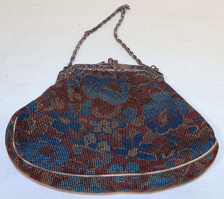 Antique Silver Plate Repousse Dog Cart Frame Floral Needlepoint Embroidery Purse
The silver plate frame has a decorative raised relief repousse chasing embossed designs of dogs, children, dog cart chariot races done on both sides. 
