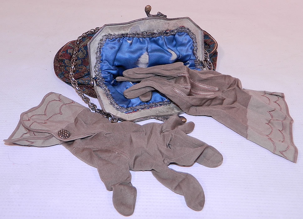 Antique Silver Plate Repousse Dog Cart Frame Floral Needlepoint Embroidery Purse
It is lined in a blue silk fabric with silver metallic lace trim edging sewn inside and a pair of gray silk gauntlet gloves found inside. 