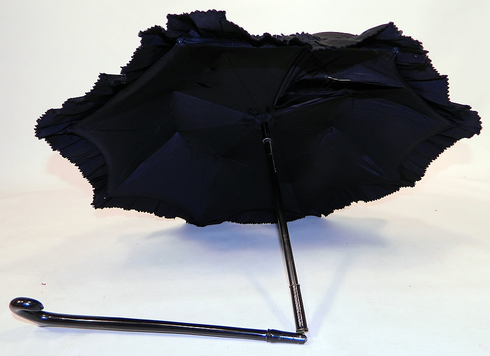 Victorian Civil War Black Silk Ebony Folding Handle Marquis Mourning Parasol
There is a black ebony wood carved handle and folding shaft, with a marquis tilt top mechanism inside to keep the sun off your face. 