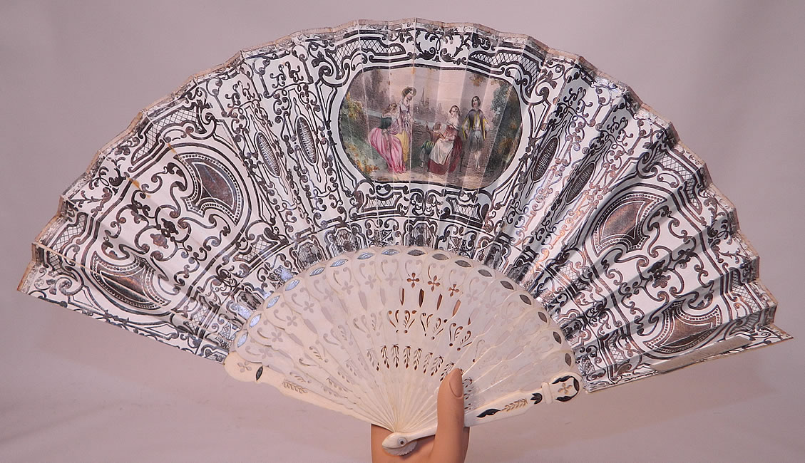 Victorian Lithograph Silver Foil Inlay Pierced Pleated Folding Fan
This fabulous folding fan has elaborate intricately carved and pierced bone sticks and guards, with silver foil inlay accents and a mother of pearl rivet holding the fan together at the bottom. 