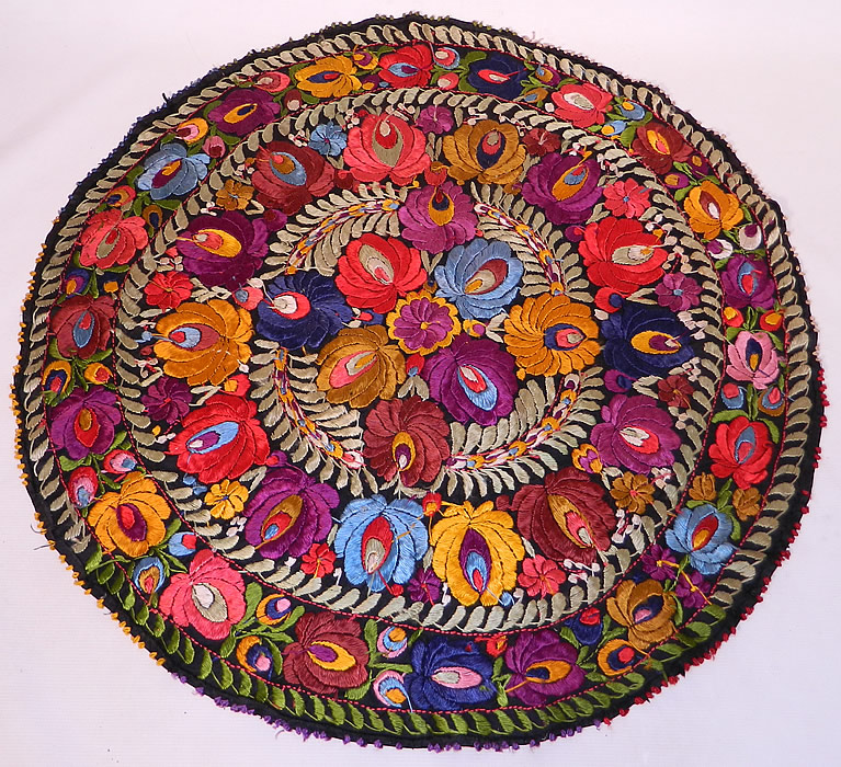 Vintage Matyo Hungarian Folk Embroidery Colorful Floral Round Tablecloth
This vintage antique Hungarian Matyo folk embroidery colorful floral round tablecloth dates from the 1920s. It is hand stitched, made of a black cotton fabric completely covered with vibrant colorful silk threads done in raised padded satin stitch Matyo embroidery work.