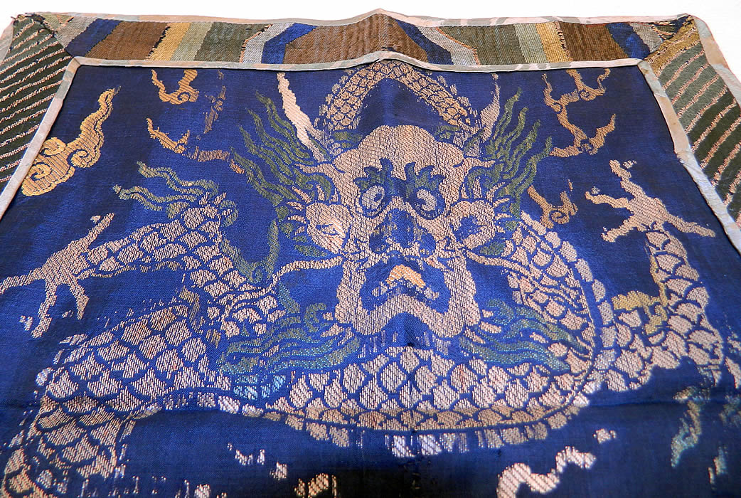 Antique Chinese Silk Damask Weave Brocade Fabric Mangpao Dragon Square Badge Textile
It is made of a blue silk damask weave brocade fabric with a colorful thread woven design. There is a "mang" four clawed dragon, with smoke clouds, a pearl and fire flames. 