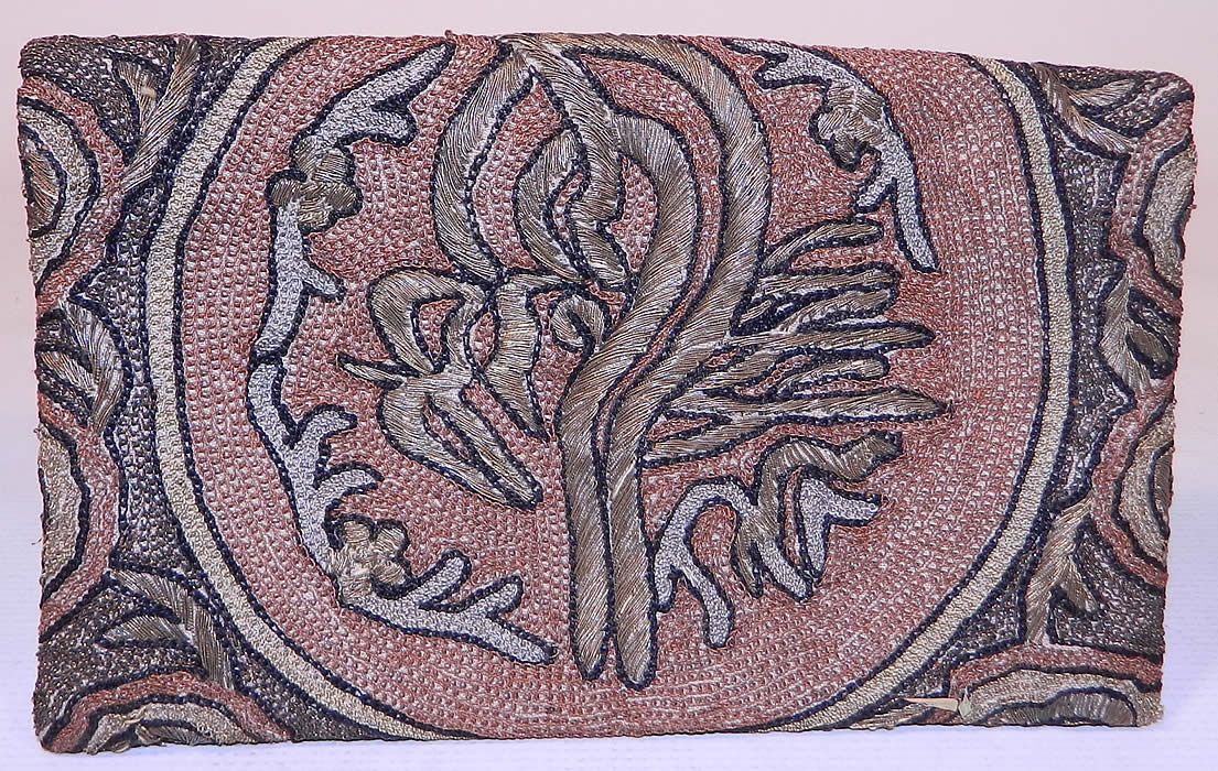 Antique Ottoman Turkish Tugra Chain Stitch Metal Thread Embroidery Clutch Purse
This antique Ottoman period Turkish Tugra chain stitch metal thread embroidery clutch purse dates from 1920s. It is made of a linen fabric, completely covered with silver, gold, copper metal thread hand embroidery work done in tambour chain stitch crewel needlework.