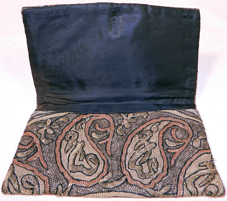 Antique Ottoman Turkish Tugra Chain Stitch Metal Thread Embroidery Clutch Purse
This exquisite envelope clutch purse has a fold over style with no closure and is fully lined in a black silk fabric. 
