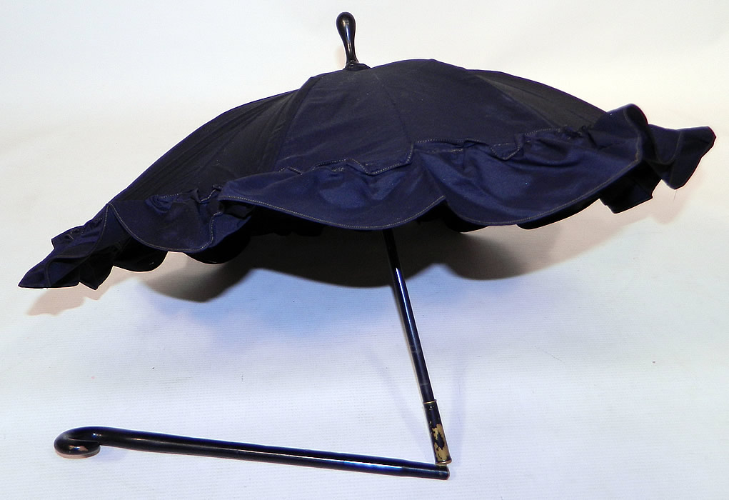 Victorian Civil War Black Silk Ebony Folding Handle Marquis Mourning Parasol
This antique Victorian Civil War era black silk ebony folding handle marquis mourning parasol dates from the 1860s.