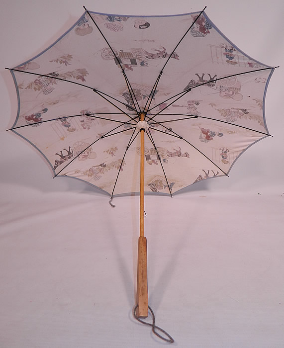 Vintage Chloe Preston Childrens Kewpie Illustration Print Linen Parasol
This whimsical charming child's pretty parasol umbrella has a black metal frame mechanism inside. 