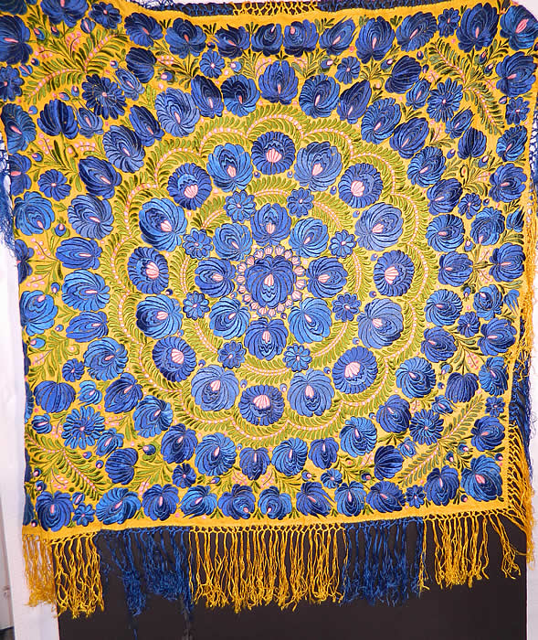 Antique Matyo Hungarian Folk Embroidery Fringe Large Square Shawl Tablecloth
There is a floral vine leaf design densely embroidered onto the fabric in a circular pattern, with hand knotted two tone yellow and blue silk fringe trim edging. The embroidery work is exquisitely done with wonderful workmanship. 
