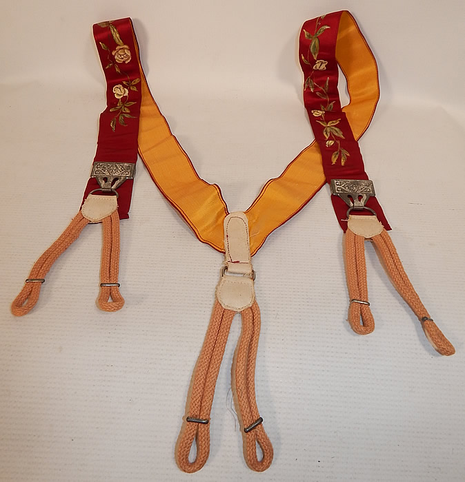 Victorian Red Silk Hand Painted White Rosebud Roses Suspenders Braces
These antique Victorian era gentleman's red silk hand painted white rosebud roses suspenders braces date from 1900. They are made of dark red burgundy color silk fabric, with hand painted white rosebud, rose flowers.