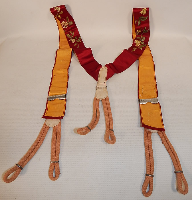 Victorian Red Silk Hand Painted White Rosebud Roses Suspenders Braces
These dashing dapper gentleman's suspenders are backed in a golden yellow color silk fabric, with white twill trim, peach rope button loop attachments and embossed silver metal hardware adjustable brackets on the front. 