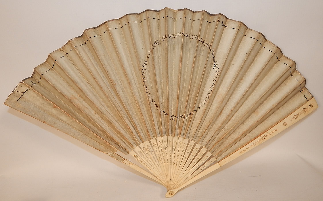 Antique 18th Century Hand Painted Paper Sequin Pierced Carved Folding Fan & Box
The box measures 11 inches long and 1 1/2 inches wide. Both are in good as-is condition, with some wear, tiny rips along the top folds of the fan, faint foxing age spot stains and a broken stick at the base (see close-up). This is truly a rare and wonderful early piece of 18th century fan art!