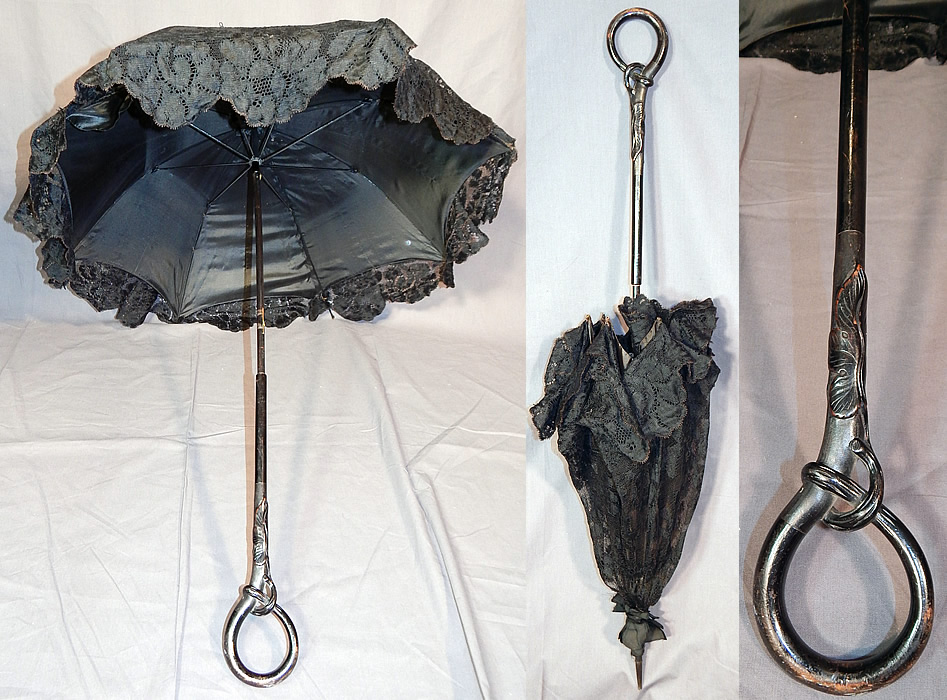 Edwardian Art Nouveau Antique Black Lace Carved Ebony Wood Handle Parasol
This antique Art Nouveau Edwardian era black lace carved ebony wood handle parasol dates from 1910. It is made of a black lace floral pattern fabric with scalloped edging.