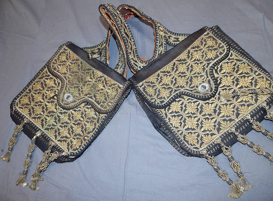 Moroccan Antique Gold Metallic Embroidered Double Saddle Messenger Bag
Each bag measures 12x12 inches, with a 14 inch shoulder strap connecting them and 4 1/2 inch long tassels. It is in good as-is condition, with some wear and is missing 1 tassel. This is truly a wonderful one of a kind piece of antique tribal ethnic embroidered Moroccan textile art!