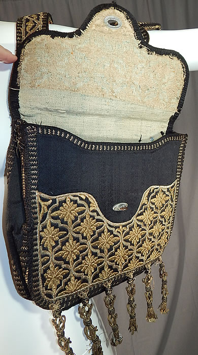 Moroccan Antique Gold Metallic Embroidered Double Saddle Messenger Bag
It is attached at the top with leather backed straps and has an envelope style pouch with metal fasteners and lined inside in a homespun linen.