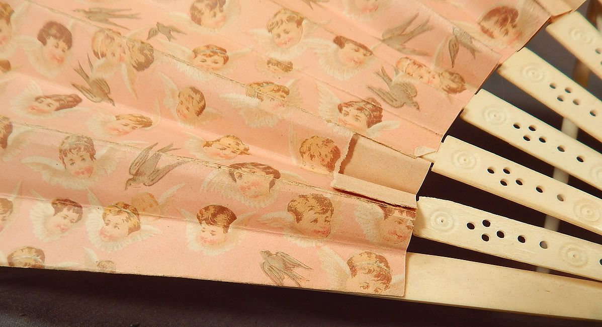 Victorian Baby Cherubs Angel Doves Print Pink Paper Pleated Large Folding Fan
It is in good as-is condition, needing some minor restoration, with a few small rips in the paper peeling on the bottom folds and a tear on the top pleated fold (see close-ups). 