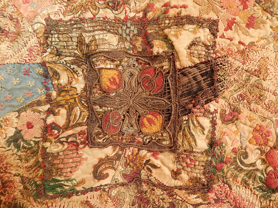 Antique 18th Century Textile Embroidered Patchwork Gold Bullion Round Tablecloth
It is made of a patchwork of pieced colorful silk, velvet and cotton brocade fabrics, with gold metallic lace appliqu&eacute; trimmings.