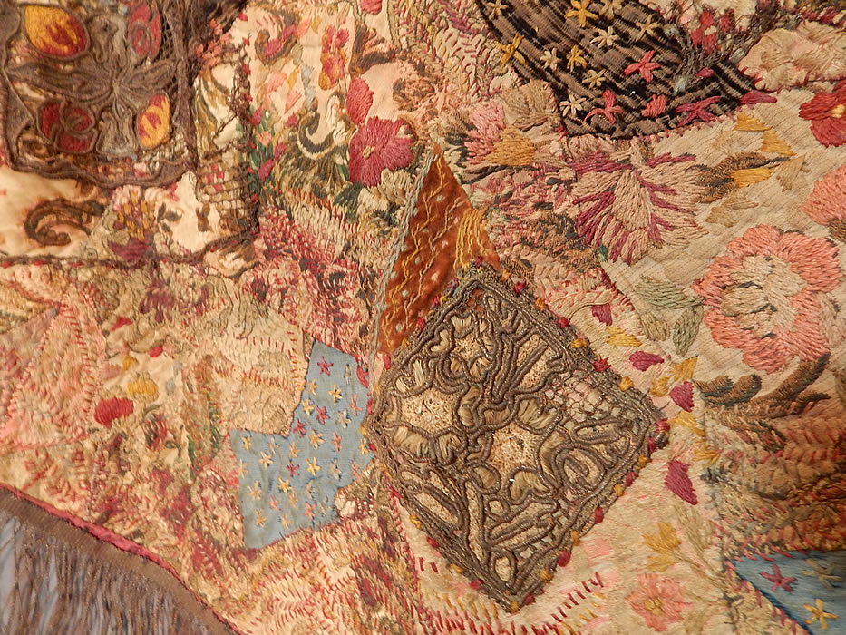 Antique 18th Century Textile Embroidered Patchwork Gold Bullion Round Tablecloth
This unique patchwork, crazy quilt style embellished textile is a sampler of needlework techniques, with a gold bullion fringe trim surrounding it and backed in a dark red burgundy cotton fabric lining.