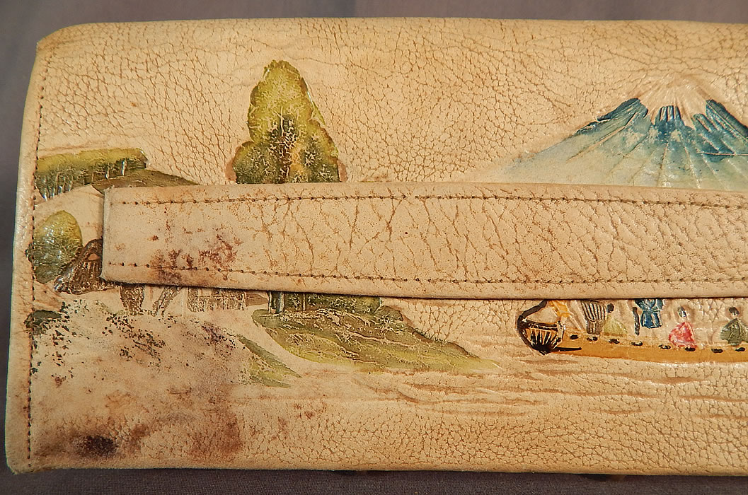Vintage Antique Japanese Hand Tooled Leather Painted Clutch Purse & Wallet
This pretty purse has a clutch envelope style, with a fold over flap snap closure, gold yellow silk lined with inside pockets, a ball clasp inner coin purse and a smaller coin purse on the bottom outside corner.