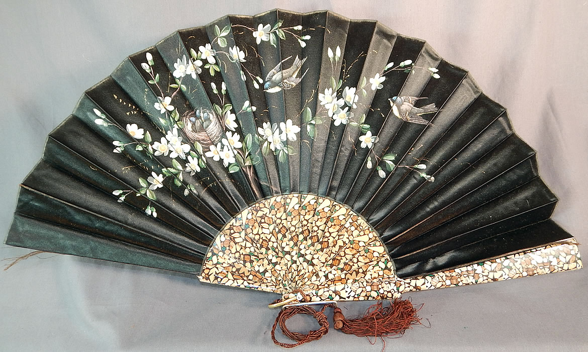 Victorian Black Silk Hand Painted Magnolia Chickadee Birds Decoupage Folding Fan
This Victorian era antique black silk hand painted magnolia, chickadee birds decoupage folding fan dates from 1900.