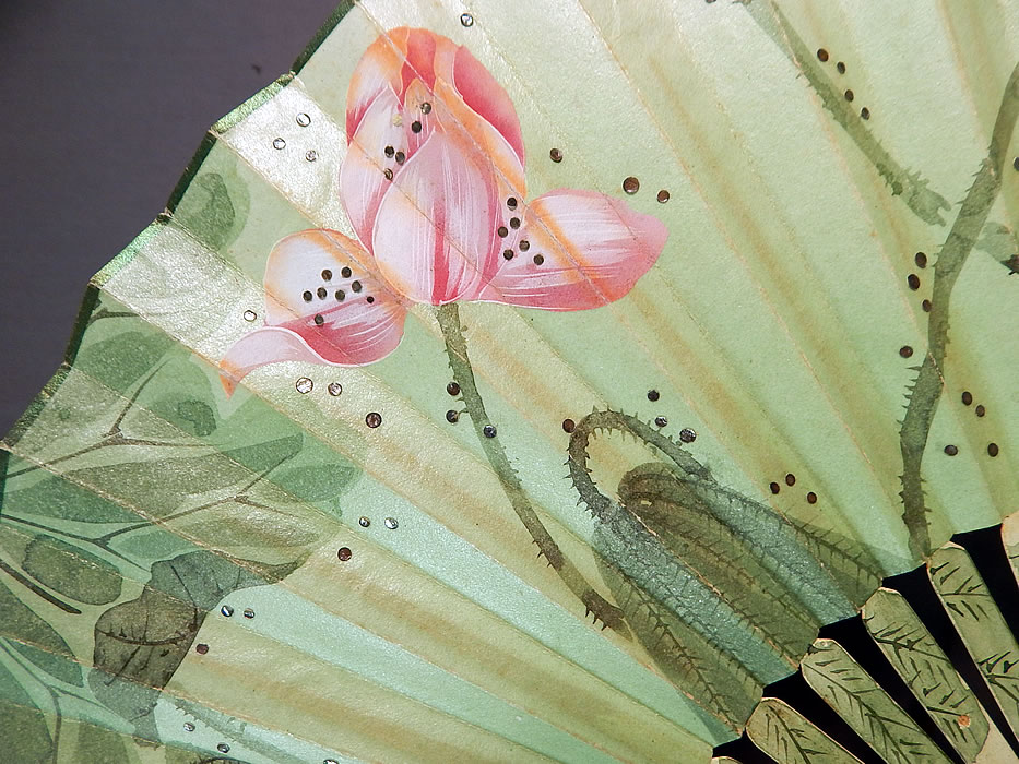 Art Nouveau Asian Hand Painted Paper Lotus Flower Sequin Pleated Folding Fan
There are tiny silver metallic sequin discs accents throughout, with white wooden sticks, guards and the painted designs continue onto them. 