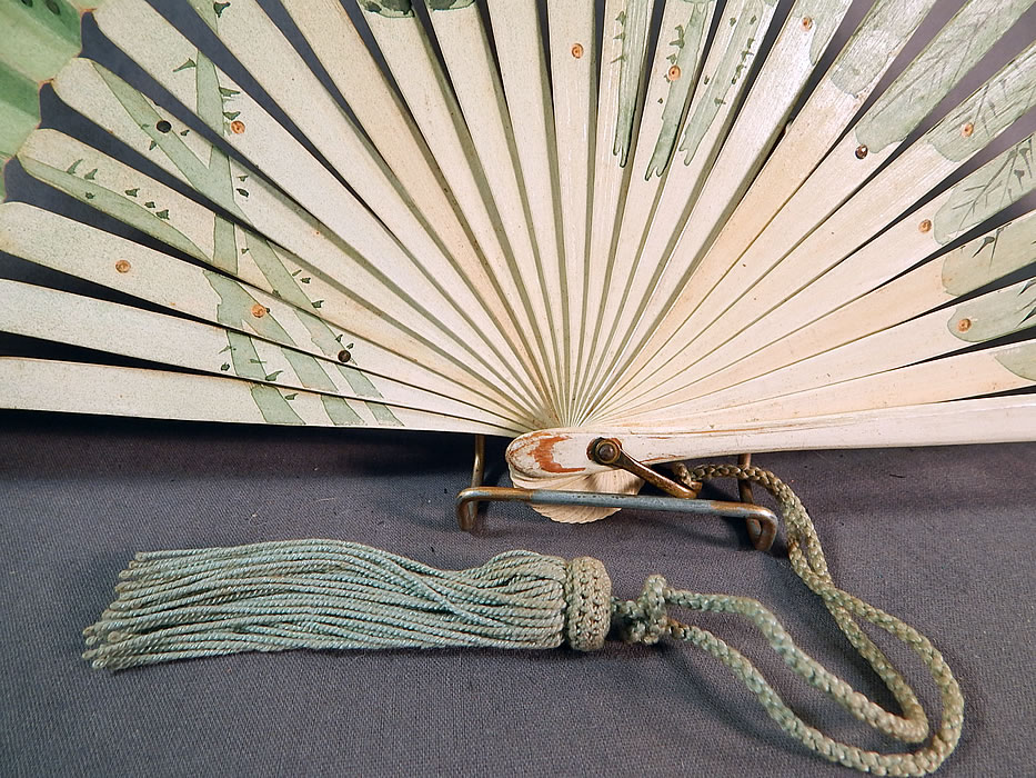 Art Nouveau Asian Hand Painted Paper Lotus Flower Sequin Pleated Folding Fan
This fabulous folding fan has an Art Nouveau, Asian, Japonism influenced design, with a brass loop ring at the bottom holding the fan together and celadon green rope tassel trim. 