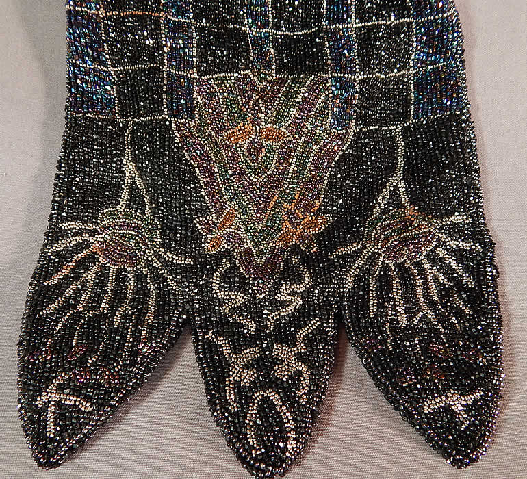 Antique Art Deco Colorful Steel Cut Beaded Floral Petal Drawstring Flapper Purse
This fabulous flapper handbag purse has a scalloped petal shape bottom, a drawstring, beaded loop tab top opening with replaced rope handle straps and has been relined in a black satin fabric inside. The purse measures 10 inches long and 7 inches wide. It is in good as-is condition, with some rust discoloration on the beadwork in areas (see close-up). This is truly a wonderful piece of antique Art Deco beaded textile art!