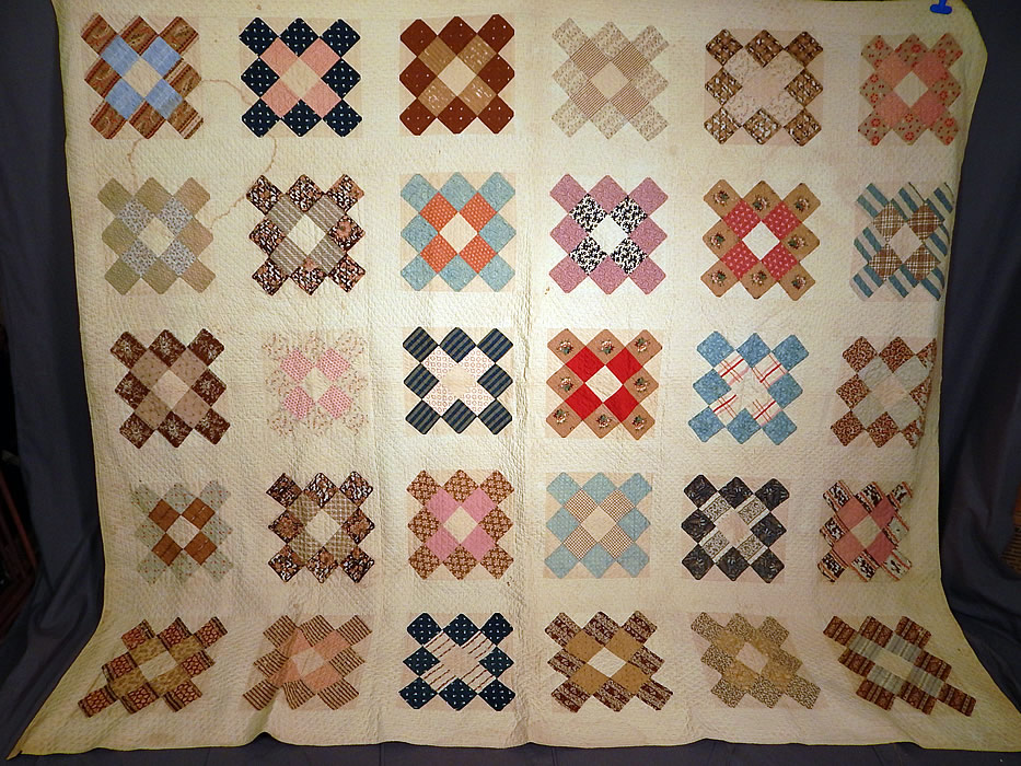 Victorian Antique Chintz Calico Cotton Fabric 12 Patch Square Block Quilt
This early Victorian era antique chintz calico cotton fabric 12 patch square block quilt dates from 1850. It is all hand stitched, with a white cotton background, made up of a variety of colorful chintz, calico cotton fabric pieces.