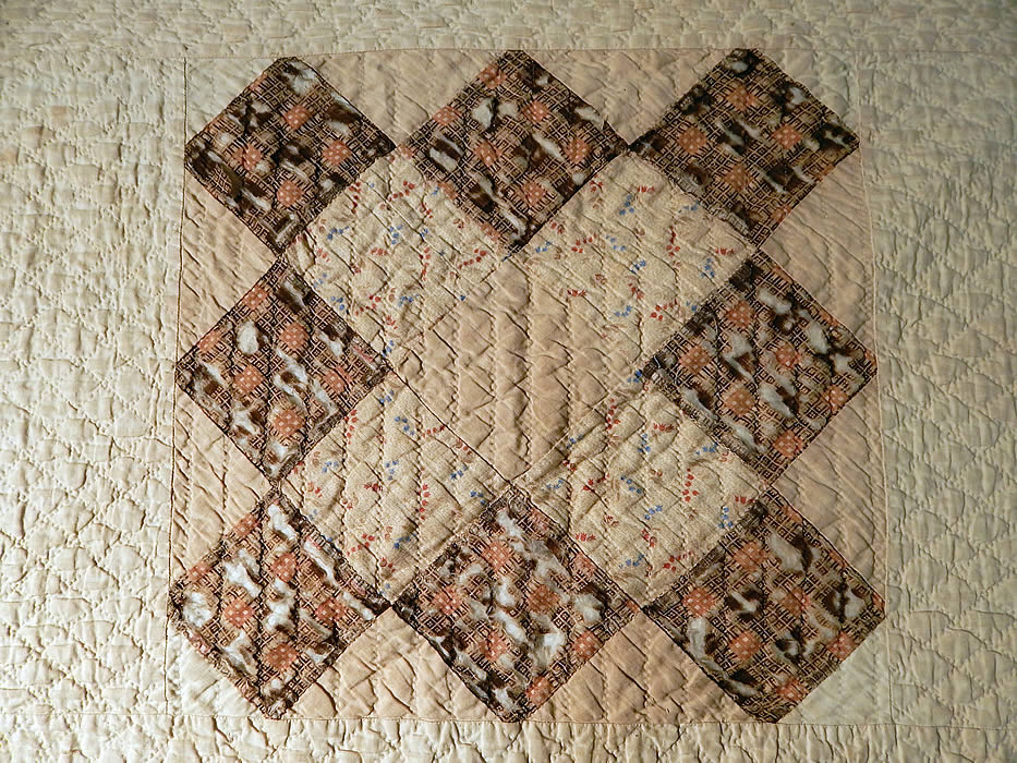 Victorian Antique Chintz Calico Cotton Fabric 12 Patch Square Block Quilt
It is backed in a white cotton fabric, with cotton batting inside, quilting stitching going through the backside and a folded over binding border edging. 