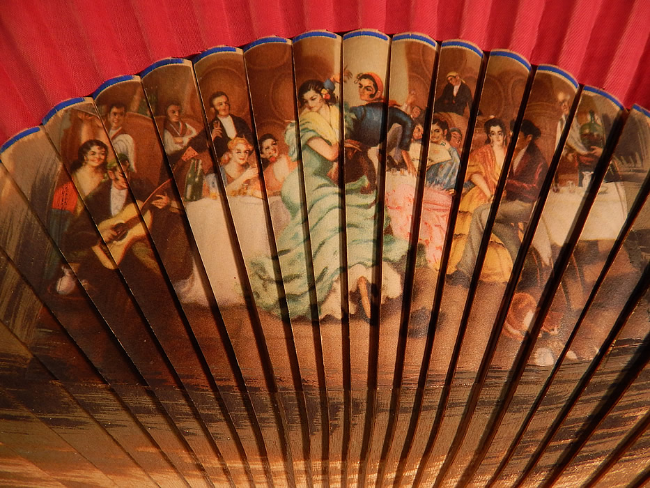 Vintage Spanish Flamenco Dancer Wood Transfer Print Pleated Fabric Folding Fan
It is made of wood sticks with a colorful transfer print on them and red pleated fabric along the top struts sticks with blue trim edging. 
