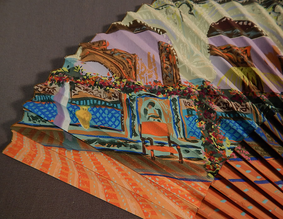 Vintage Hand Painted Spanish Courtyard Pleated Paper Spain Souvenir Folding Fan
It is made of pleated paper and wood struts sticks completely hand painted with a colorful Spanish courtyard fountain scene and gold leaf trim edging along the top. 