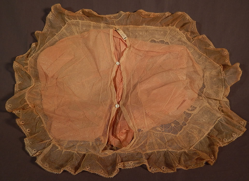 Vintage Embroidered Tulle Net Drawn Cutwork Grape Leaf Lace Boudoir Bed Pillow
This beautiful boudoir bed pillow sham case cover has an oval shape, with ruffle trim edging and an opening on back for inserting a pillow with tiny mother of pearl button closures. 