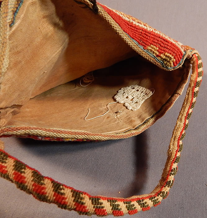 Victorian Antique Civil War Era Wool Mohair Carpet Bag Sewing Notions Purse
It is lined in linen, with a stiffened hard bottom inside, a button loop closure on the front and a jacquard loom woven green and red striped carrying strap on top.